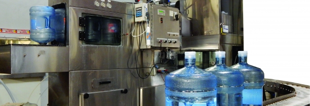 Photo of new 5 gallon bottled water washer, filler, and capper.
