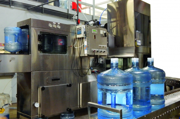 Photo of new 5 gallon bottled water washer, filler, and capper.